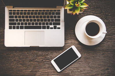 High angle view of coffee cup on table