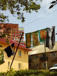 Low angle view of clothes drying against the sky