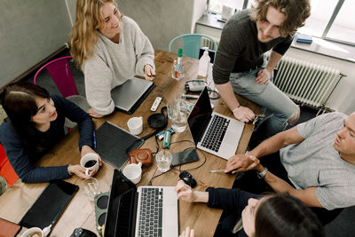 High angle view of coworkers working in office