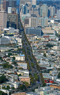 Aerial view of main tree lined street in city
