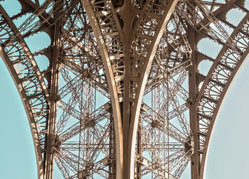 Low angle view of metallic structure of eiffel tower against sky
