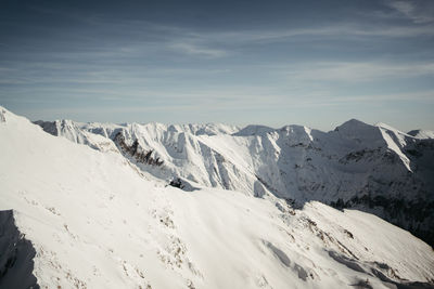 Scenic view of snowcapped mountains against sky