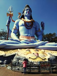 Low angle view of statue against building