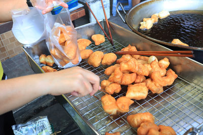 High angle view of man preparing food on barbecue grill