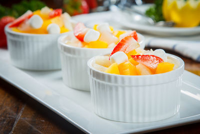 Close-up of orange fruit in plate