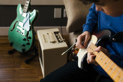 Close up of musician playing electric guitar