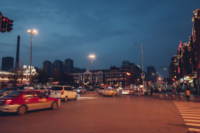 Cars on city street at night