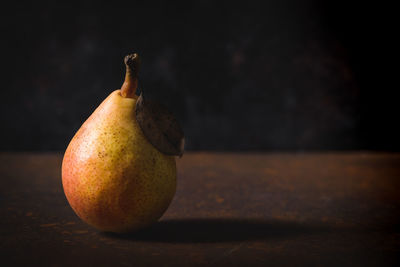 Close-up of pear on table