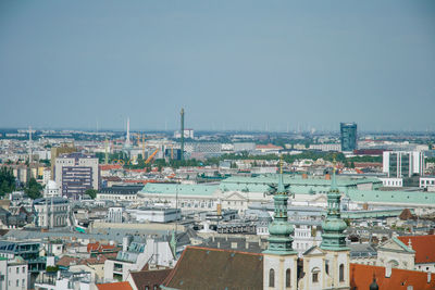 High angle view of buildings in city against clear sky