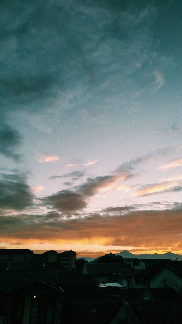 SILHOUETTE HOUSES AGAINST SKY DURING SUNSET