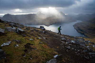 Scenic view of mountains against cloudy sky