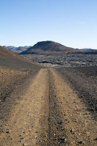 Scenic view of desert against clear sky