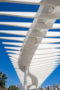 Low angle view of bridge against clear blue sky