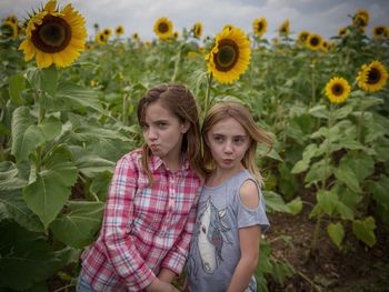 Two girls posing on field