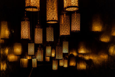 Full frame shot of illuminated lanterns in darkroom