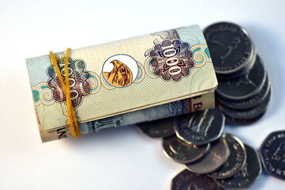 High angle view of coins on table