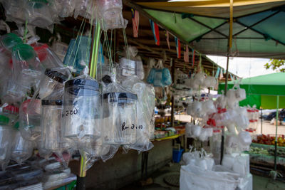 Clothes hanging in market stall