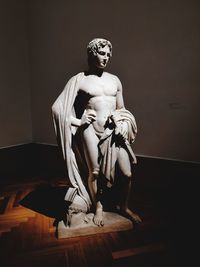 Statue of woman sitting in museum