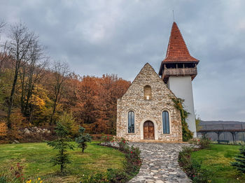 View of temple building against cloudy sky