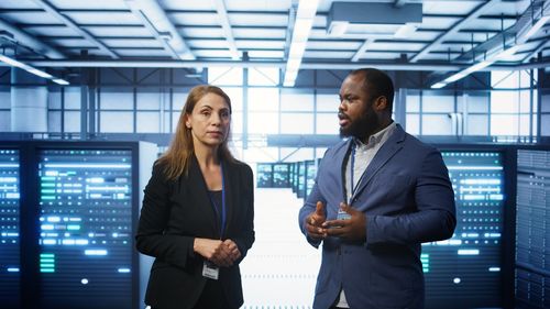 Business colleagues standing in office