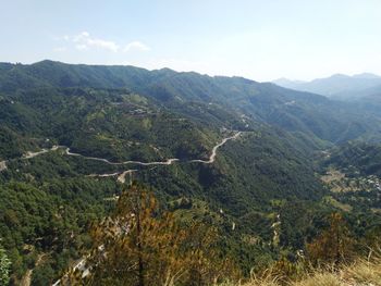 High angle view of trees and mountains against sky