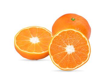 Close-up of orange fruit against white background