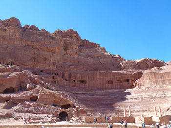 View of rock formation against clear blue sky