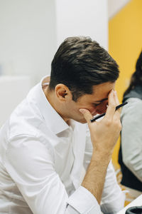 Worried businessman working in office