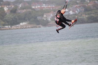 Man jumping in sea