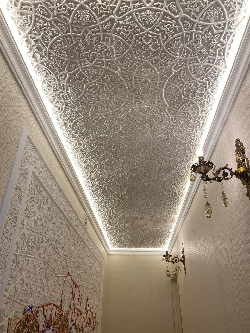 LOW ANGLE VIEW OF ILLUMINATED CEILING OF BUILDING