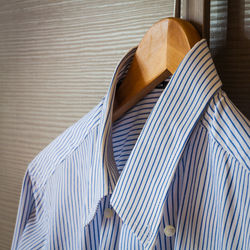 Close-up of shirt on coathanger at home