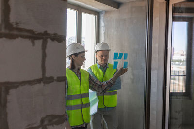 Side view of man working at construction site