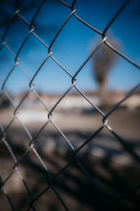 Full frame shot of chainlink fence against sky