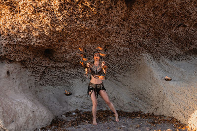 Full length of man standing on rock