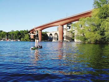 Bridge over river against clear sky