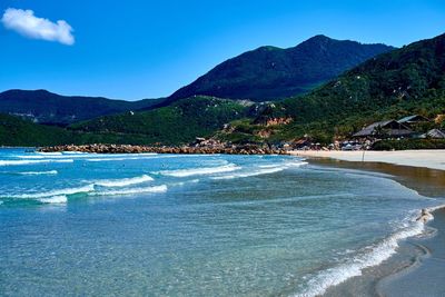 Scenic view of sea against blue sky