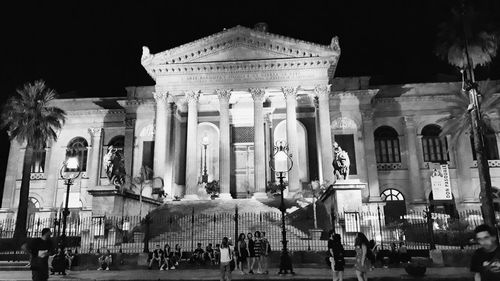 Group of people in front of historical building