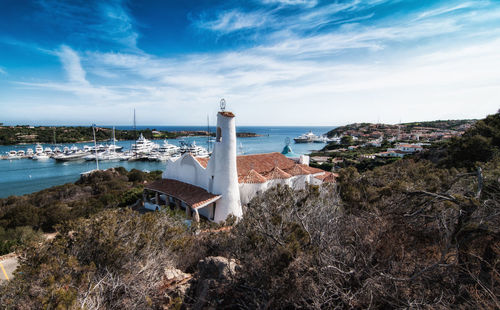 Scenic view of sea and buildings against sky