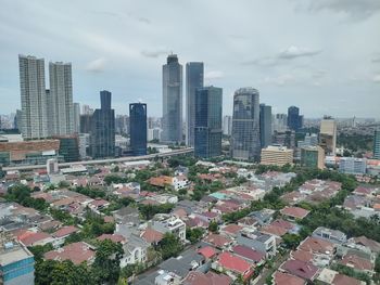 High angle view of buildings in city against sky