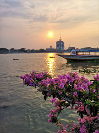 Scenic view of river against sky during sunset