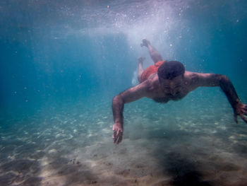 Man swimming in sea