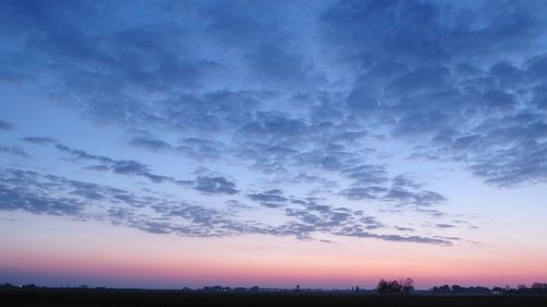 Scenic view of silhouette landscape against sky during sunset