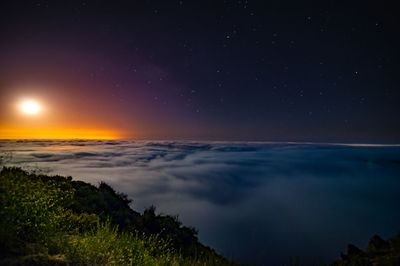 Scenic view of sea against sky at night