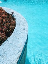 High angle view of retaining wall by swimming pool