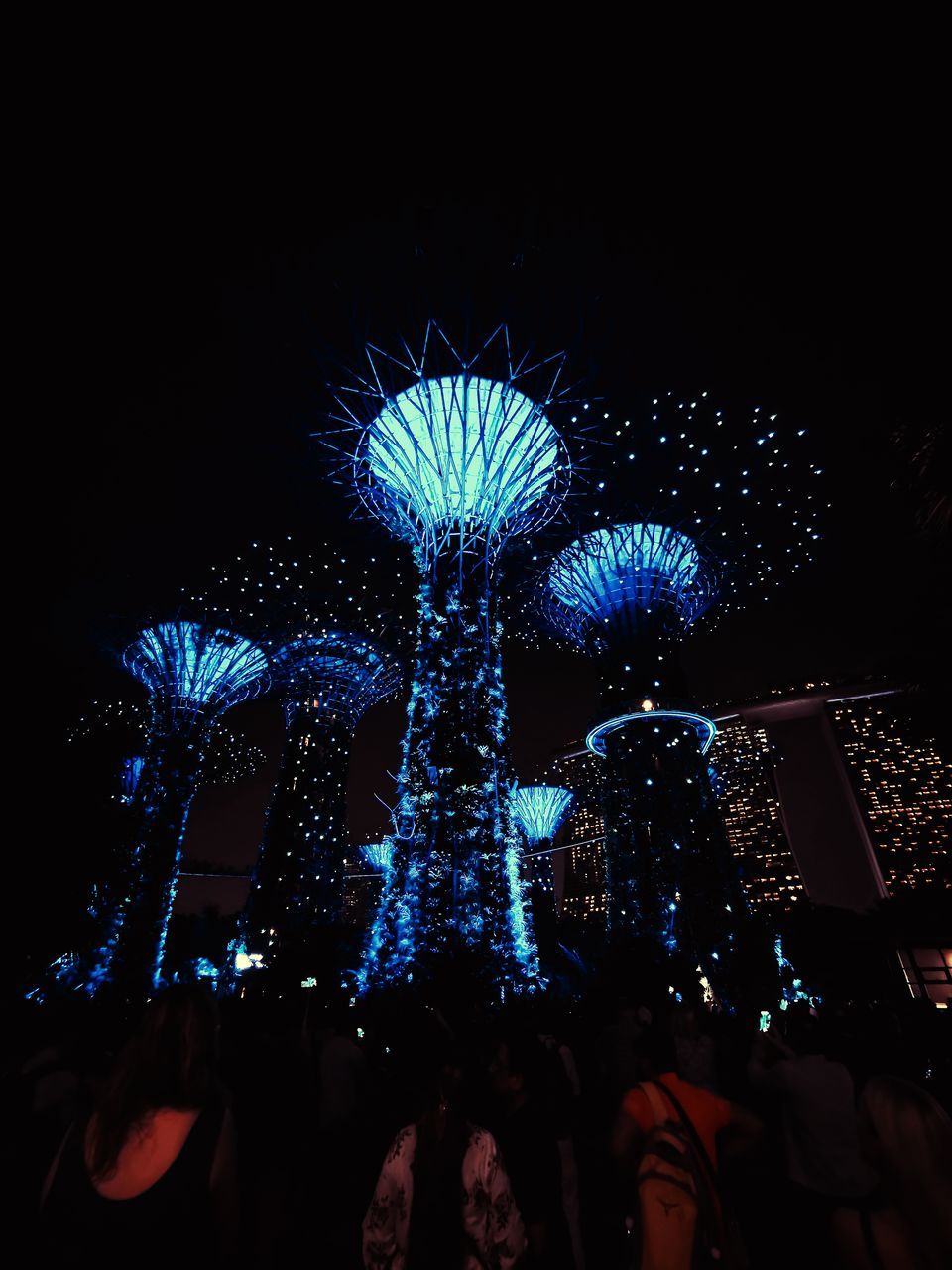 LOW ANGLE VIEW OF ILLUMINATED FERRIS WHEEL AGAINST CLEAR SKY