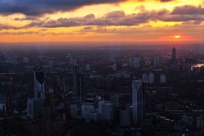 Aerial view of city at sunset