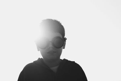 Close-up portrait of boy against white background