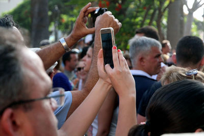 Woman taking picture on her smart phone