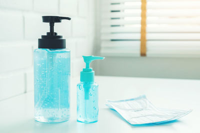 Close-up of blue bottles on table