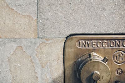 High angle view of text on old wall